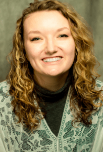 Portrait of a woman with curly blonde hair