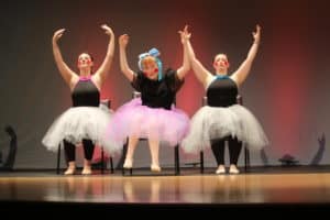 danceability 2022 Recital three dancers wearing tutus on stage