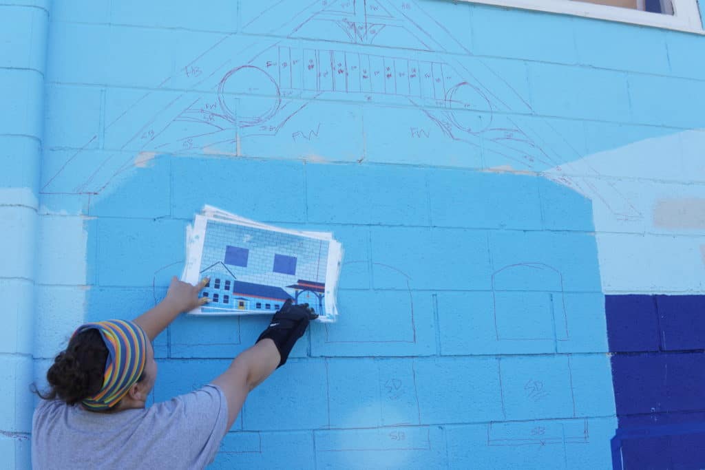 Artist Audra Linsner compares her mural designs to the painted wall